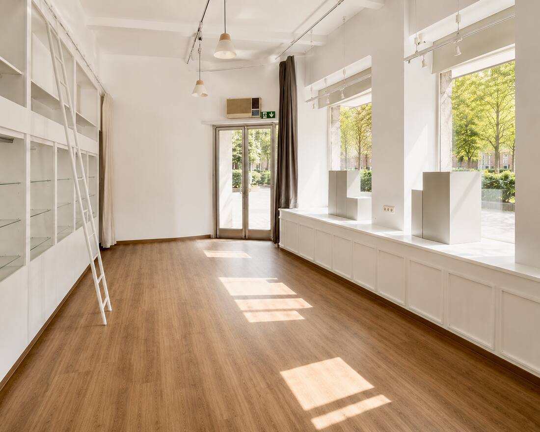Sunday Studios Cologne — sunlit event location with large windows facing the trees